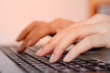 Hand of male typing text on keyboard laptop.working online business. Sensitive focus. 