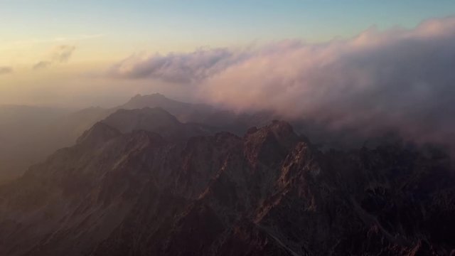 Evening timelapse aerial view of Gerlachov Peak (Gerlachovsky stit) and High Tatras mountains, Slovakia
