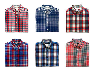 top view of folded red, blue and white color long sleeve plaid shirts isolated on white background
