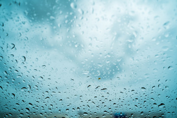 Rain drops on the windshield In the evening when heavy rain