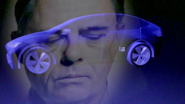Close up reflection of industrial engineer designing an electric car using 3D software (variation without glasses)