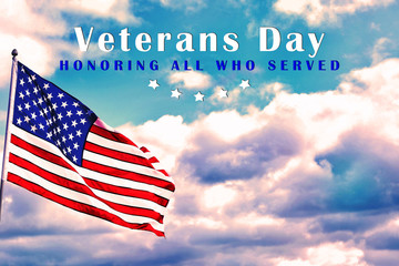 American flag outdoors on cloudy day. Space for text