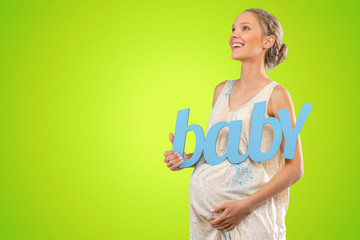 Portrait of the young happy smiling pregnant woman