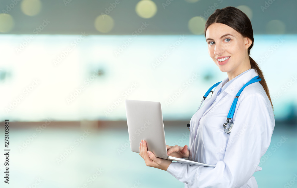 Canvas Prints portrait of an attractive young female doctor in white coat