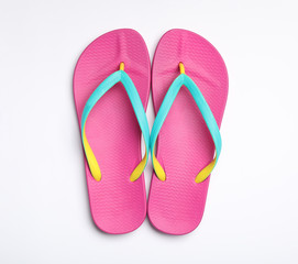 Pair of flip flops on white background, top view. Beach accessories