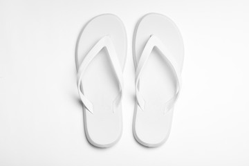Pair of flip flops on white background, top view. Beach accessories