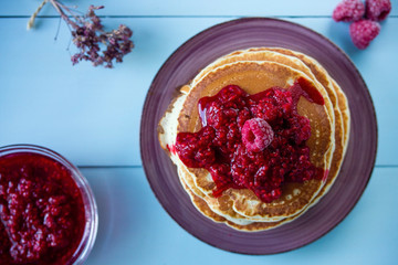 Healthy breakfast,homemade classic pancakes with fresh raspberry jam. top view
