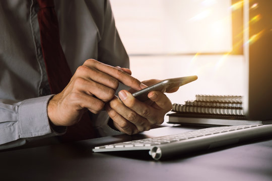 Social media and Marketing virtual icons screen of businesswoman typing keyboard with laptop computer at office at morning light