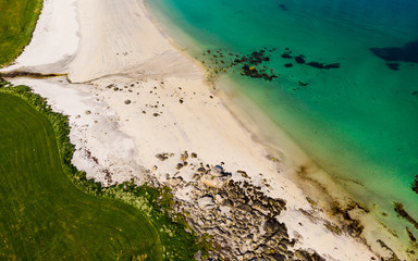 Aerial view. Sea water and sandy shoreline