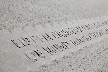 Küchenrückwand glas motiv Printing a poem in the sand with tyre tracks at the beach. Island of Vlieland. Waddenzee.. Dutch coast. North Sea. Noordzee. Wadden. © A
