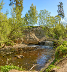 Waterfall on the river Sablinka in the village of Ulyanovsk, Leningrad region.