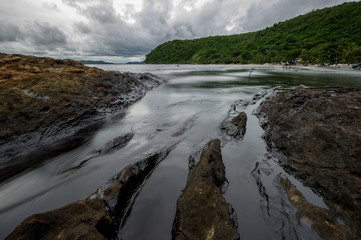 Oil sludge contaminating the sea during the oil spill disaster in Samet Island, Rayong, Thailand.