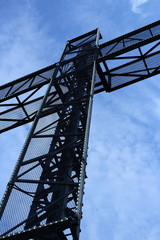 Large cross, blue sky, clouds