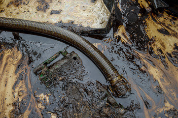 Oil spill diaster - Greasy oil tools and polluting environment at Samet Island, rayong, thailand