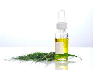 Cannabis with extract oil in a bottle