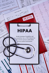 Health Insurance Portability and accountability act HIPAA, red folder with inscription confidential...