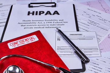 Health Insurance Portability and accountability act HIPAA, red folder with inscription...