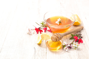 bowl of honey with flowers