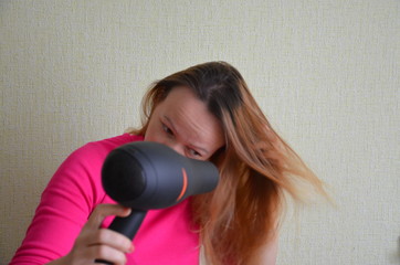 Hair Dryer. Beautiful Smiling Girl With Long Straight Hair Using Hairdryer. Portrait Of Happy Female Using Blow Hair Dryer. Hairstyle, Hair Care Concept. High Resolution