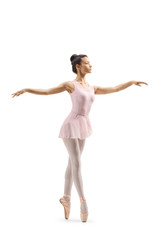 Young female ballet dancer dancing on tiptoes