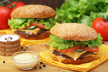 Two fresh hamburgers with vegetables
