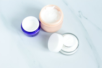 Set of different cosmetics cream. Blank label package for branding mock-up, Natural organic beauty product concept.Set of bowls with moisturizer cream. 