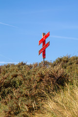 Red cross in the dunes on the East Frisian Island Juist in the North Sea, Germany.