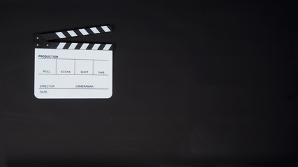 White Clapperboard or clap board or movie slate on black background. It's use in video production ,...