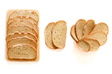 Whole grain bread. Assortment of baked bread, slices of rye bread. Baked bread  isolated on white background, top view.Bakery, food concept. 