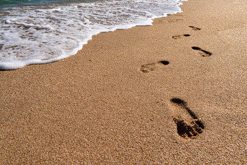 Human footprints on the seashore