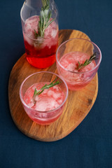 Cocktail With Rosemary And Melting Ice
