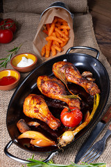 grilled chicken legs in barbecue marinade with sweet potatoes