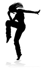 A woman street dance hip hop dancer in silhouette