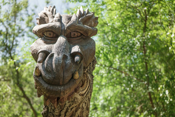 Fototapeta na wymiar The head of a fairy dragon in a children's park