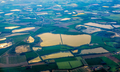 Aerial view of village landscape near Amsterdam town over clouds in Netherlands