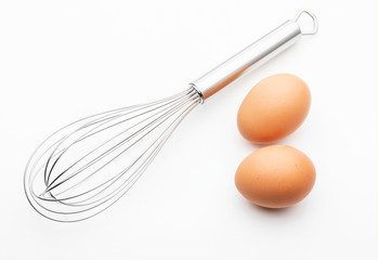 Metallic kitchen rods for manually mixing food with 2 fresh eggs (collection of cooking objects)....