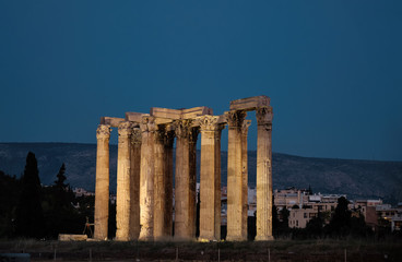 Fototapeta premium view by night of illuminated Temple of Olympian Zeus in the blue hour in the City of Athens - Greece