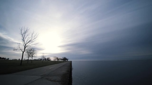 Pan Left Milwaukee Lakefront Bike Trail During Morning Sunrise Cloudy Day