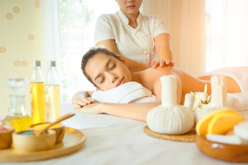 Obraz na płótnie Canvas Body care. Beautiful young woman taking spa body treatments and having massage in the spa salon