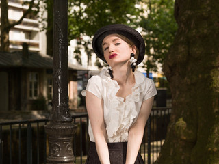 Blonde girl with a hat.