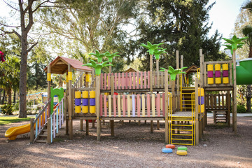 kid's playground made of wood, plastic and metal