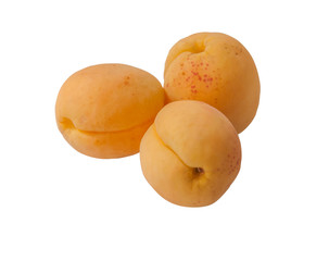 three ripe sweet apricots isolated on white close up