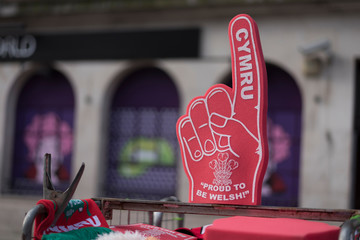 Sports supporters foam hand, for Wales / Cymru. For sale in an international rugby match in Cardiff, Wales