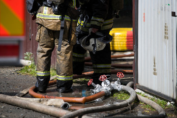 firefighters extinguish the fire house