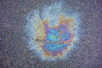 Oil Petrol Pollution Leak Rainbow Stain on Pavement