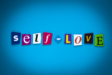 Text Self-Love on blue background from colorful letters. Multicolored inscription on card, banner. Headline, caption, heading. Psychologic concept. Message on poster.