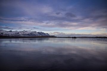  Iceland natural landscape in winter with snowy mountains and a nice river.