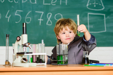 Kid study biology chemistry. Boy microscope and test tubes school classroom. Basic knowledge primary school education. Educational experiment. Knowledge concept. Fascinating subject. Knowledge day