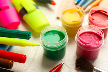 Drawing supplies on white wooden background, closeup