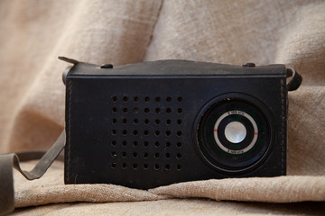 old soviet tape recorder on a flax texture background